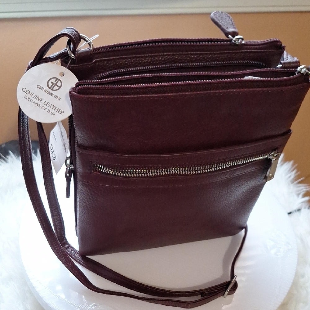 Burgundy Leather Crossbody Bag with Adjustable Strap and Multiple Compartments